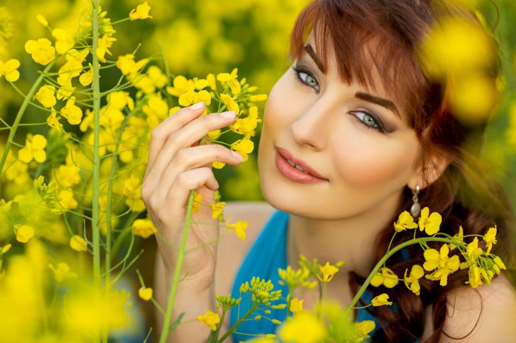 beautiful girl in blue dress with yellow flowers